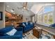 Relaxing living room with a kitchenette, window seat, and blue sofas at 327 Lotus Path, Clearwater, FL 33756