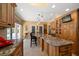 Large kitchen island with granite countertop and seating for four at 327 Lotus Path, Clearwater, FL 33756