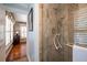 Bathroom with walk-in shower, and view into hallway at 327 Lotus Path, Clearwater, FL 33756
