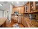 Well-equipped kitchen with granite countertops and ample wood cabinetry at 327 Lotus Path, Clearwater, FL 33756