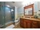 Spa-like bathroom with a walk-in shower and updated vanity at 327 Lotus Path, Clearwater, FL 33756