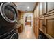 Convenient laundry room with washer, dryer and built-in storage at 327 Lotus Path, Clearwater, FL 33756