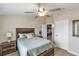 Comfortable bedroom with wood-look floors and ensuite access at 6420 Banyan Blvd # 303, New Port Richey, FL 34652