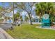 Gated community entrance with a guardhouse and seating area at 6420 Banyan Blvd # 303, New Port Richey, FL 34652