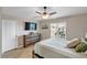 Bedroom with a dresser, TV and window at 6420 Banyan Blvd # 303, New Port Richey, FL 34652