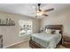 Bright bedroom with a comfortable bed and water view at 6420 Banyan Blvd # 303, New Port Richey, FL 34652