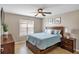 Bedroom with a full bed, window and dresser at 6420 Banyan Blvd # 303, New Port Richey, FL 34652