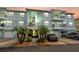 Two-story building with light teal exterior and attached garages at 6420 Banyan Blvd # 303, New Port Richey, FL 34652