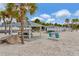 Beachfront picnic area with covered gazebos and seating at 6420 Banyan Blvd # 303, New Port Richey, FL 34652