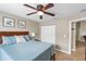 Bedroom with a queen bed and double door closet at 6420 Banyan Blvd # 303, New Port Richey, FL 34652