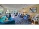 Spacious living room with hardwood floors and sliding glass doors to patio at 900 Cove Cay Dr # 1H, Clearwater, FL 33760