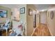 Condo entryway with wood floors, kitchen, and living area visible at 900 Cove Cay Dr # 1H, Clearwater, FL 33760