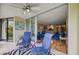 Bright sunroom with sliding doors to living room and view to the outdoors at 900 Cove Cay Dr # 1H, Clearwater, FL 33760