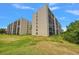 Two-building exterior view showcasing a well-maintained lawn at 900 Cove Cay Dr # 1H, Clearwater, FL 33760