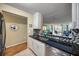 Modern kitchen with stainless steel appliances and granite countertops at 900 Cove Cay Dr # 1H, Clearwater, FL 33760