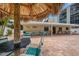 Community patio with shaded seating near the pool at 900 Cove Cay Dr # 1H, Clearwater, FL 33760