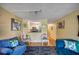 Bright living room with hardwood floors and view to kitchen at 900 Cove Cay Dr # 1H, Clearwater, FL 33760