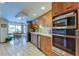 Modern kitchen with stainless steel appliances and wood cabinets at 4981 61St S Ave, St Petersburg, FL 33715