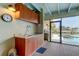 Outdoor kitchen and sink with pool and canal view at 4981 61St S Ave, St Petersburg, FL 33715