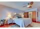 Main bedroom with king-size bed and en-suite bathroom access at 4981 61St S Ave, St Petersburg, FL 33715