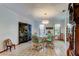 Charming dining room with glass-top table and Asian-inspired decor at 4981 61St S Ave, St Petersburg, FL 33715
