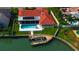 Bird's-eye view showing home, pool, dock, and canal at 4981 61St S Ave, St Petersburg, FL 33715