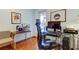 Home office with glass desk, computer, and comfortable seating at 4981 61St S Ave, St Petersburg, FL 33715
