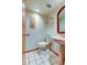 Small powder room with pedestal sink, toilet and floral wallpaper at 4981 61St S Ave, St Petersburg, FL 33715