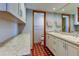 Double vanity bathroom with updated cabinets and tiled floor at 4981 61St S Ave, St Petersburg, FL 33715