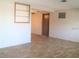 Living room with wood-look flooring and built-in shelving at 4102 Darlington Rd, Holiday, FL 34691