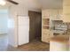 Bright kitchen with white cabinets, new flooring and stainless steel appliances at 4102 Darlington Rd, Holiday, FL 34691