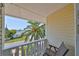Balcony featuring water views and an abundance of tropical foliage at 13004 Boca Ciega Ave, Madeira Beach, FL 33708
