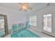 Bright bedroom with modern decor featuring a mirrored dresser and accent rug at 13004 Boca Ciega Ave, Madeira Beach, FL 33708