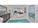 Open-concept living room featuring modern decor and access to an entertainment area at 13004 Boca Ciega Ave, Madeira Beach, FL 33708