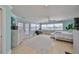 Spacious main bedroom with many windows and a view of the balcony at 13004 Boca Ciega Ave, Madeira Beach, FL 33708