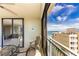 Relaxing balcony featuring outdoor seating with a glimpse of the stunning ocean view at 1380 Gulf Blvd # 1008, Clearwater Beach, FL 33767