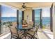 Relaxing balcony view featuring a dining table set and ocean view at 1380 Gulf Blvd # 1008, Clearwater Beach, FL 33767