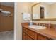 Cozy bathroom with storage vanity, mirror, and closet for keeping things tidy at 1380 Gulf Blvd # 1008, Clearwater Beach, FL 33767