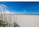 Tranquil beach view with clear skies, showcasing the property's serene beachfront location at 1380 Gulf Blvd # 1008, Clearwater Beach, FL 33767