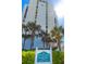 Exterior of Sand Key Club building with landscaping at 1380 Gulf Blvd # 1008, Clearwater Beach, FL 33767