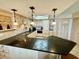 Spacious kitchen features granite countertops, updated cabinets, and stainless steel appliances at 1380 Gulf Blvd # 1008, Clearwater Beach, FL 33767