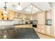Updated kitchen features custom cabinetry, granite countertops, and stainless steel appliances at 1380 Gulf Blvd # 1008, Clearwater Beach, FL 33767
