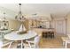 Bright kitchen featuring a breakfast bar with seating, updated cabinets and stone countertops, and stainless appliances at 1380 Gulf Blvd # 1008, Clearwater Beach, FL 33767