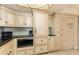 Bright kitchen featuring a built-in refrigerator, modern microwave, and sleek countertops at 1380 Gulf Blvd # 1008, Clearwater Beach, FL 33767