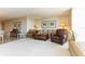 Neutral living room with plush seating and cozy accents and large area rug at 1380 Gulf Blvd # 1008, Clearwater Beach, FL 33767