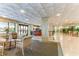 Bright lobby area with tiled floors, comfortable seating, and a reception desk near the entrance with automatic doors at 1380 Gulf Blvd # 1008, Clearwater Beach, FL 33767