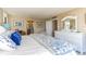 Comfortable main bedroom suite with a view to the connected main bathroom and closet at 1380 Gulf Blvd # 1008, Clearwater Beach, FL 33767