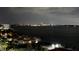 Night view of waterfront condos, bay, and city skyline across the water at 1380 Gulf Blvd # 1008, Clearwater Beach, FL 33767