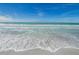 Beautiful ocean view with gentle waves and a sandy beach, creating a peaceful scene at 1380 Gulf Blvd # 1008, Clearwater Beach, FL 33767