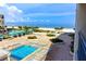 Luxurious pool and lounge area overlooking pristine beaches and clear blue ocean waters at 1380 Gulf Blvd # 1008, Clearwater Beach, FL 33767
